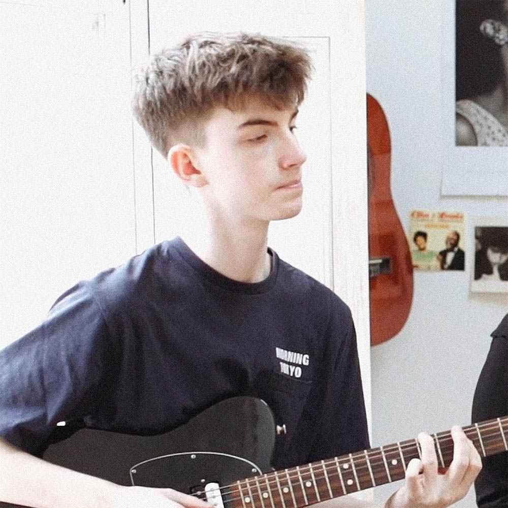 Conor Albert with guitar